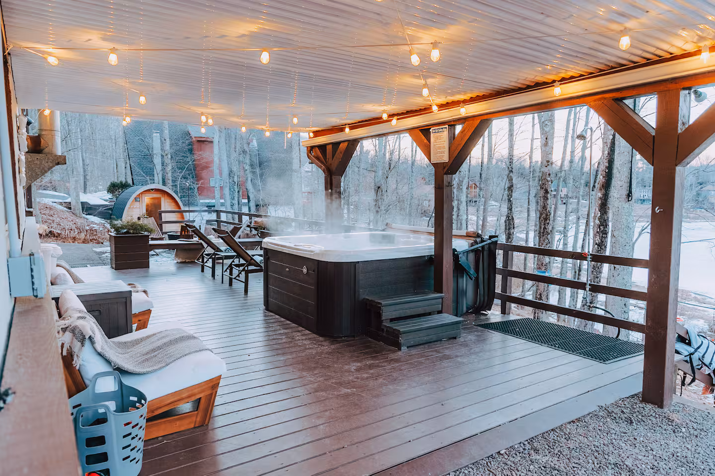 Snowy deck and hot tub at the retreat lodging